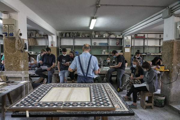 Spilimbergo (Pordenone, Italy), the Friuli School of Mosaic. Students make a mosaic dome during a "terrazzo" lesson.