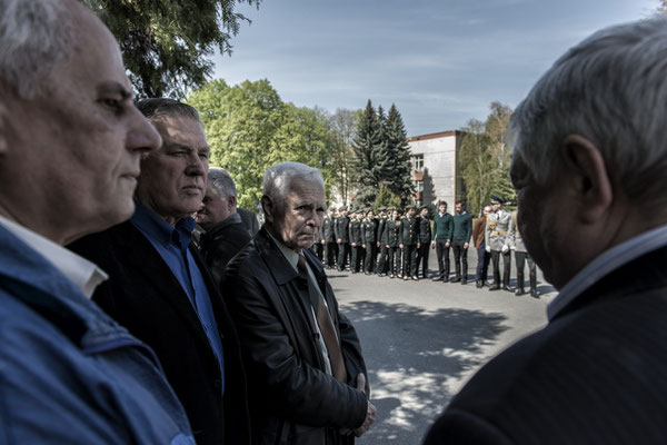 Former liquidators awaiting the delivery of medals in memory of the Chernobyl accident. Main square of the city of Chernobyl.