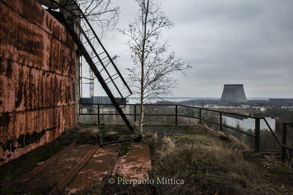 The cooling tower of unfinished reactor number five as seen from the roof of reactor number 5