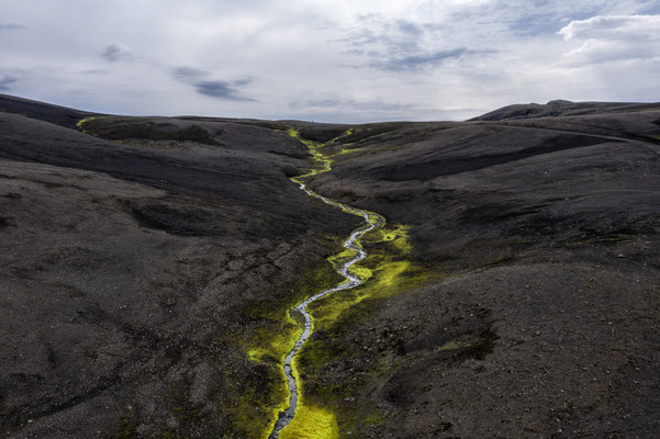 Iceland. The landscape along the road that leads to the Landmannalaugar base camp. The area is a popular tourist destination due to its fascinating geological formations, such as the multi-coloured rhyolite mountains