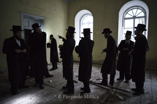 Jews inside the abandoned Chernobyl Synagogue.