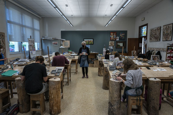 Spilimbergo (Pordenone, Italy), the Friuli School of Mosaic. First-year students use hammers to cut the mosaic tiles. During the first year of the course, students focus mainly on the history of mosaic