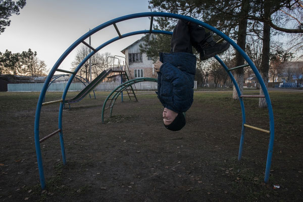 Igor playing in the school park waiting for the school bus to take him home, Radinka