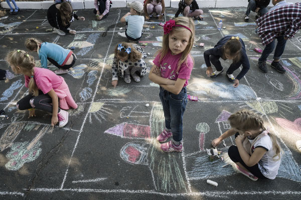 Children playing in the main square of Ivankiv during the local fair