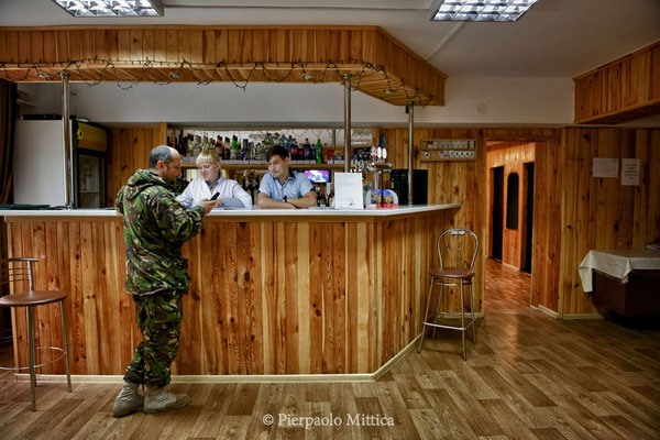 Yevgen Goncharenko in a work break in the bar inside the hotel, Chernobyl city, the exclusion zone