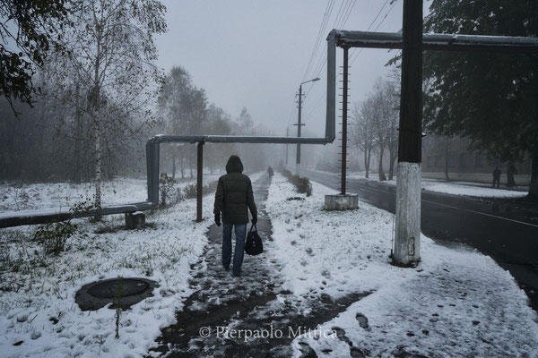 A worker while going home in Chernobyl town. Today in Chernobyl town 4000 workers live