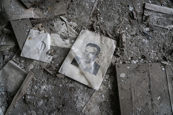 A school book lies on the floor in an abandoned school in Ochamchire.