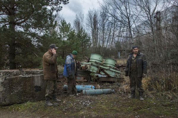 Workers in search of radioactive scrap metal to be recycled. Chernobyl Exclusion Zone.