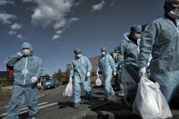Workers coming back from their shift at the Fukushima nuclear power plant, J Village, Naraha.