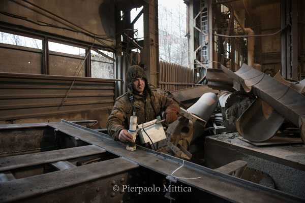 Yuriy while checking the contamination level of the scrap metal after the sandblasting 