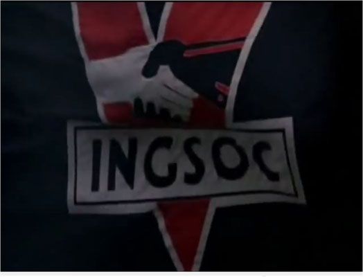 die Fahne der INGSOC, der Partei des English Socialism, beinhaltet das klassische, durch Winston Churchill berühmt gewordene "V" für Victory, sowie eine schwarze und weiße Hand, die einander reichen, offenbar als Symbol für sozialistische Brüderlichkeit