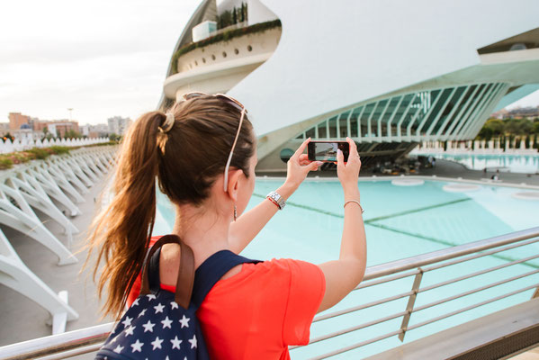 Happy tourist is taking of the City of Arts and Sciences in Valencia, Spain - Copyright photobobak
