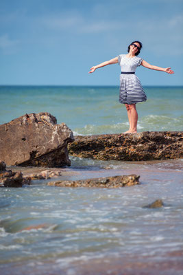 Young beautiful woman on beach vacation in Liepaja Copyright  Levranii