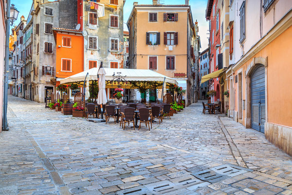 Spectacular stone paved street with colorful houses and typical street cafe bar, Rovinj old town,Istria region,Croatia,Europe - Copyright Gaspar Janos