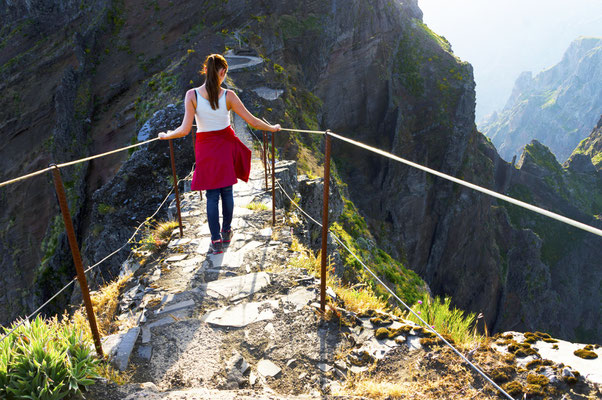 Young girl on the winding mountain trekking path at Pico do Areeiro, Madeira, Portugal Copyright Mikadun