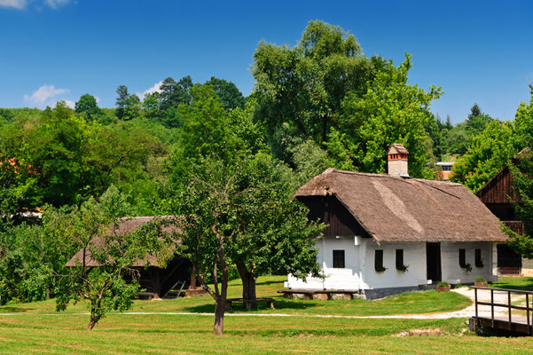 Idyllic village scene in Croatian countryside. Kumrovec historical village, Zagorje area of Croatia - Copyright Evgeniya Moroz