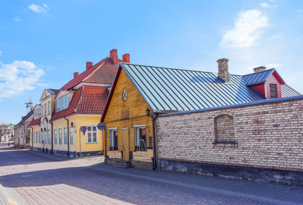 Wooden houses in Ventspils of Latvia by Roman Babakin