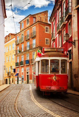 Tram on narrow street of Alfama, Lisbon, Portugal, retro toned Copyright  Neirfy