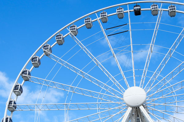 A big Ferris wheel in Manchester UK with blue sky Copyright Doubleo44