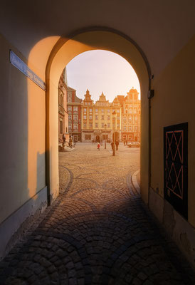 View from under the arch on market square during sunset, in Wroclaw, Poland Copyright Velishchuk Yevhen