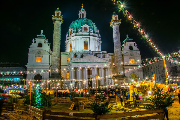 Christmas market taking place in front of the karlskirche in Vienna - By trabantos