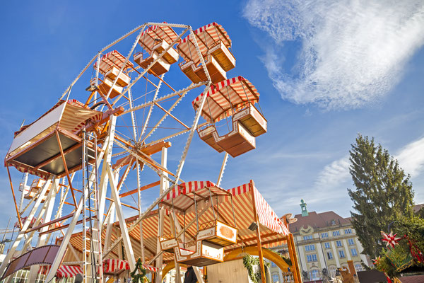 Ferry wheel on Christmas market Striezelmarkt in Dresden, Saxony, Germany - By Mariia Golovianko