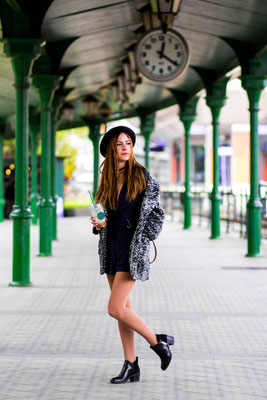 Young beautiful pretty girl walking along the street with handbag and cup of coffee in Wroclaw Copyright Kateryna Petrushynets