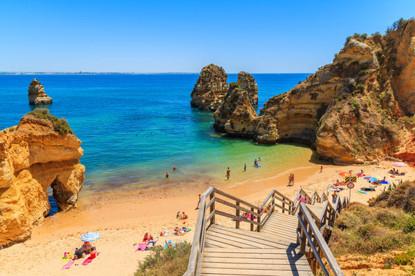 Wooden footbridge to beautiful beach Praia do Camilo, Portugal Copyright Pawel Kazmierczak