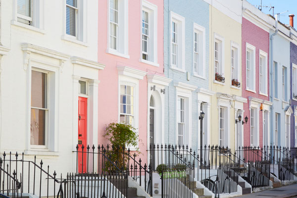 Colorful English houses facades, pastel pale colors in London Copyright andersphoto