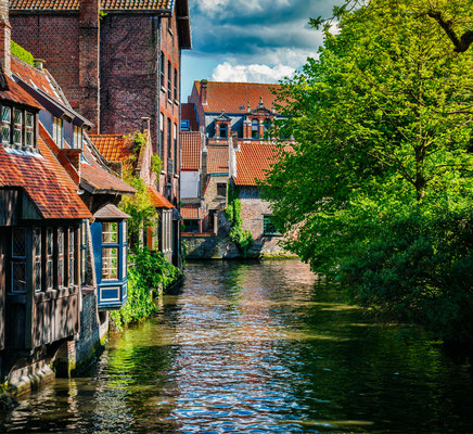 Bruges - European Best Destinations - Canal and Medieval Houses in Bruges - Copyright Dmitry Rukhlenko