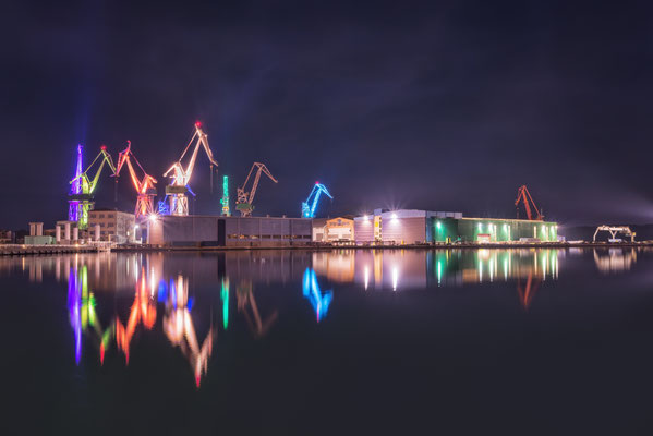 lluminated cranes in Pula by carol.anne