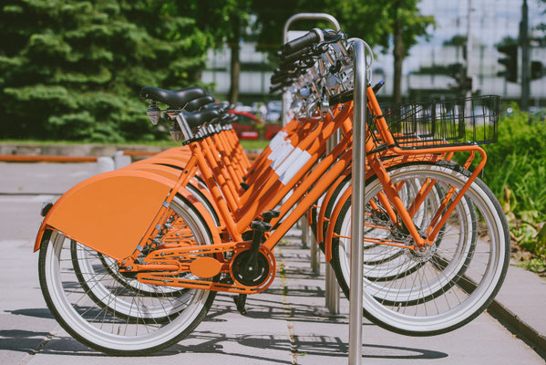 Row of city bikes for rent at docking stations in Kaunas, Lithuania - Copyright  A. Aleksandravicius