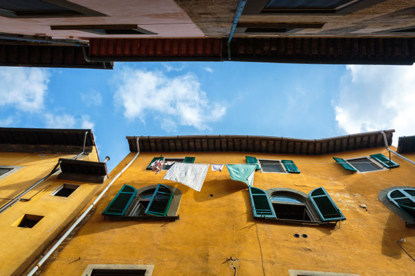 Hanging clothes on a beautiful building in Pisa, Italy - Copyright Sabino Parente