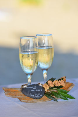 two champagne glasses with engraved stone