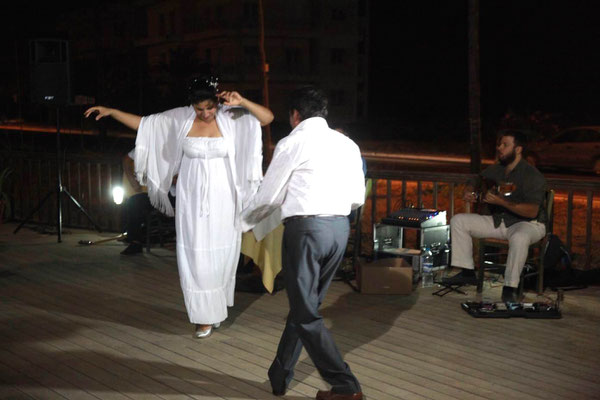 bride and groom dancing at their Greek wedding