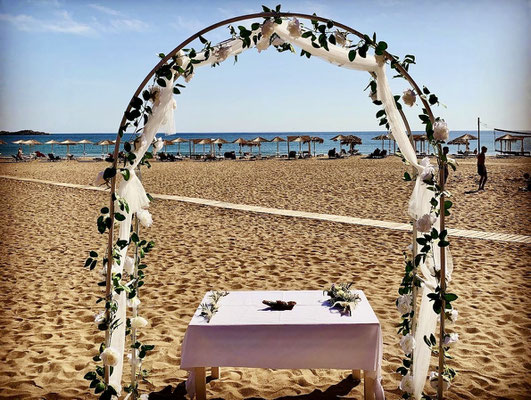 arch of roses on Sandy beach in Paleochora