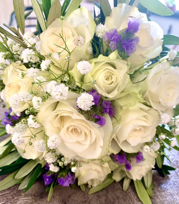 wedding bouquet with white roses and purple flowers