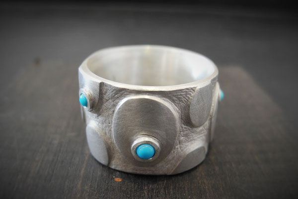 breiter 925/000 silberring mit türkis-cabochons.