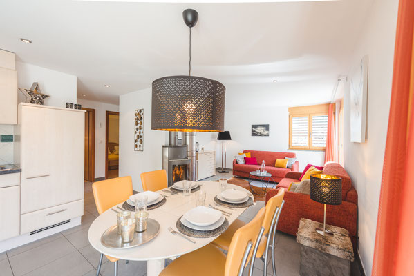 Dining area with modern and well-provided kitchen.