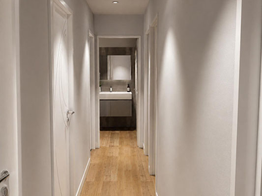 Couloir lumineux avec portes blanches, sol bois clair et perspective vers une salle de bain contemporaine.