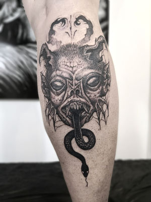 dark blackwork mask snake tattoo