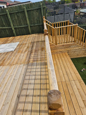 Aberdeen garden decking with wooden handrail and steps leading to lower garden – custom outdoor decking installation
