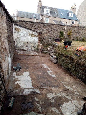 Cleared garden showing the area where the building used to be.