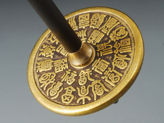 Handspindel aus Münze