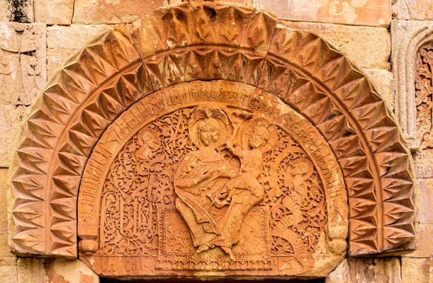 Lower tympanum, represents a Virgin with Child