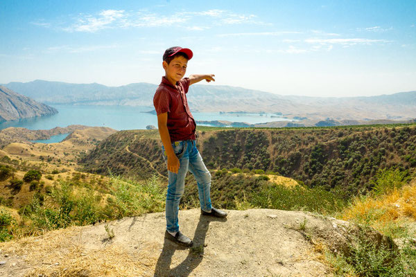 a boy point on the Nurek reservoir