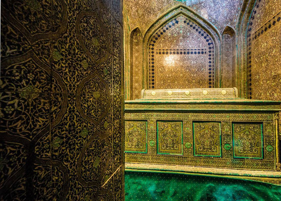 a smaller chamber containing the tomb of Pakhlavan Mahmoud himself. The crypt can be seen through the portals of two elaborate wooden doors inlaid with ivory, coral and copper