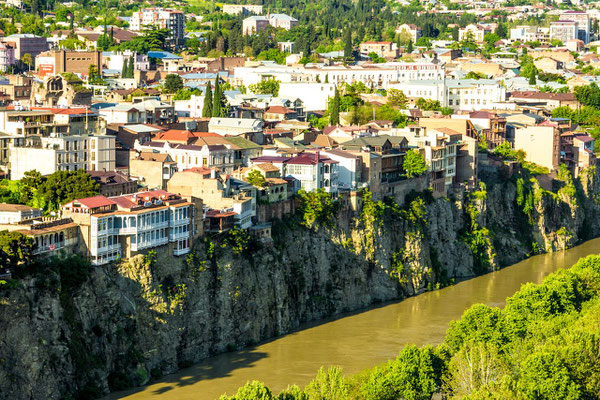 Houses still clung to the cliffs above the Kura river as they did centuries ago ....