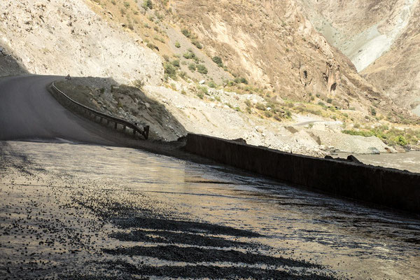 under a natural carwash station: a mountain stream flowing over a rock ledge