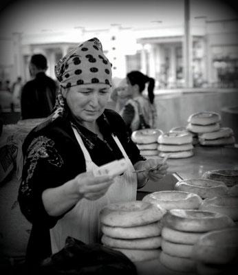 Bazaar of Tashkent, Uzbekistan -  flatbread saleswoman